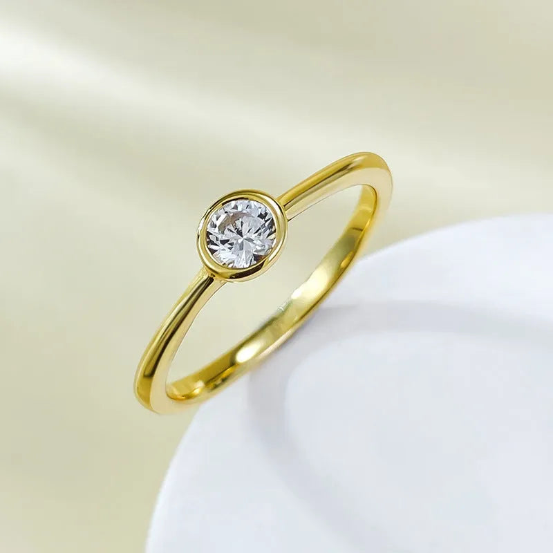 Minimalist silver crown-shaped ring with linear design, shown in electroplated gold and platinum finishes.