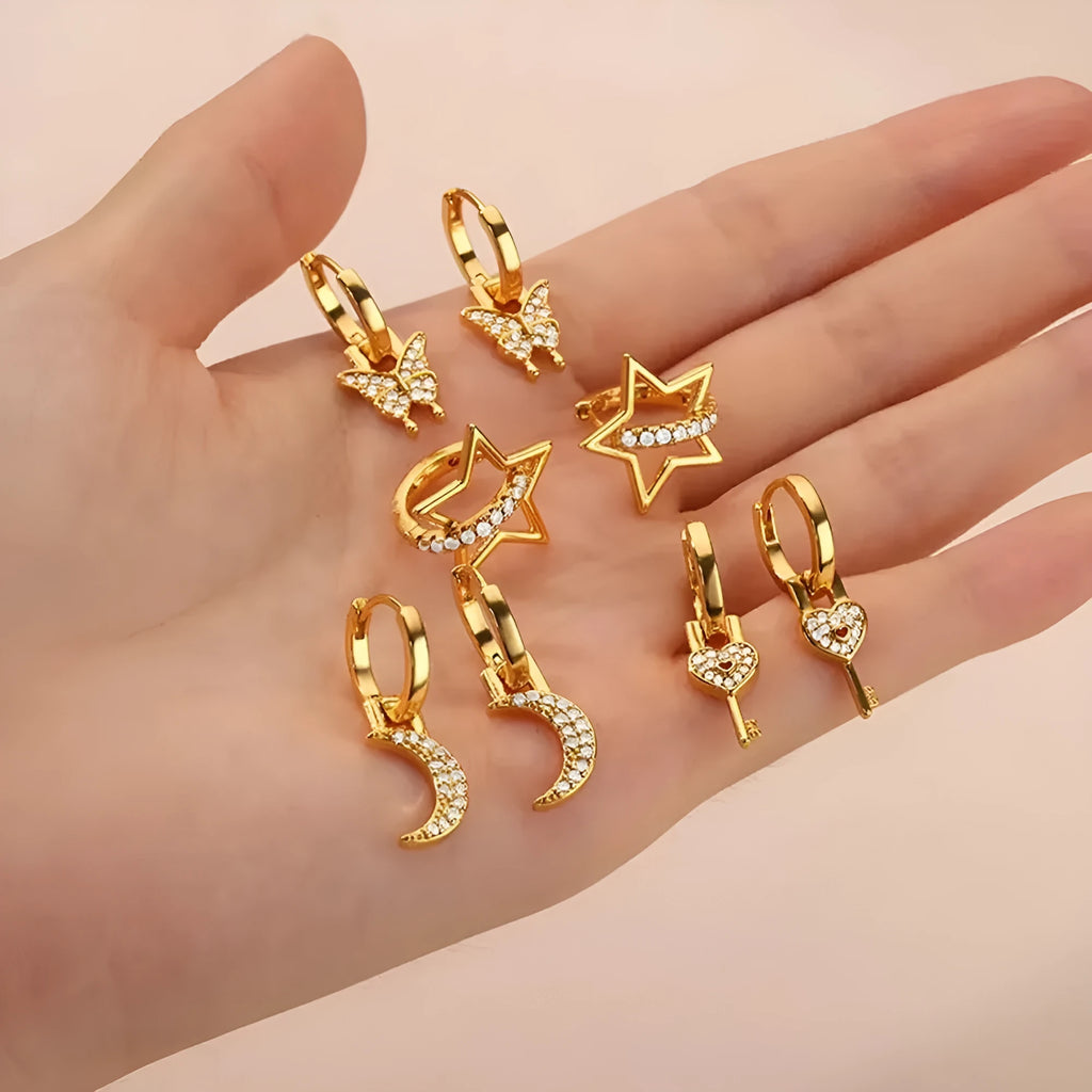 Women's irregular geometric butterfly earrings in copper with heart, bow and star motifs