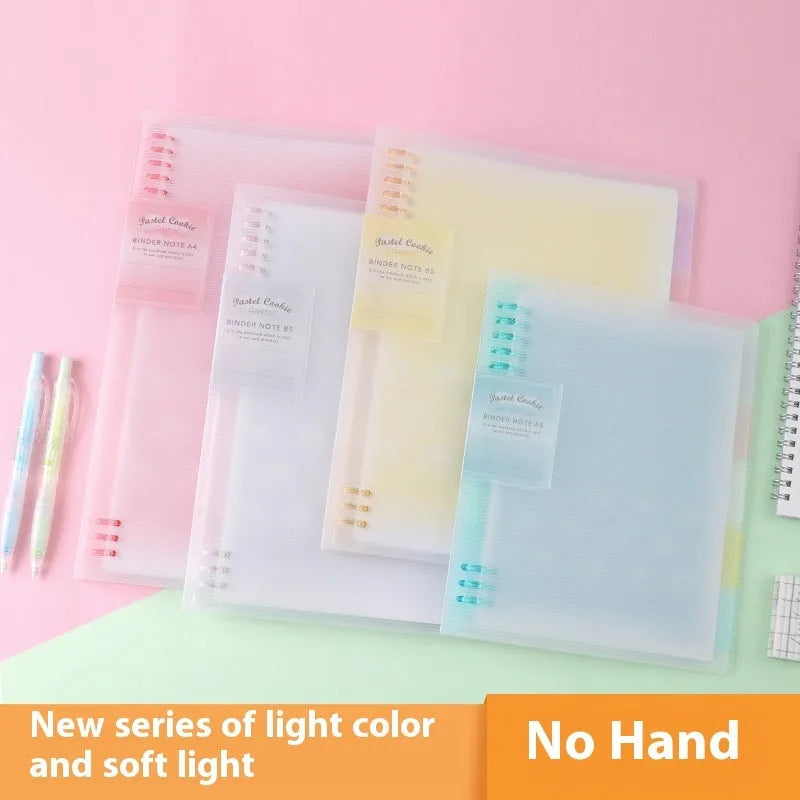 Refillable spiral notebook in pastel blue with loose-leaf paper visible.