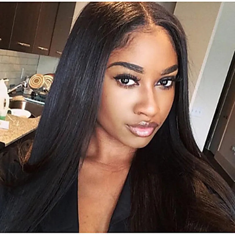 Long straight black synthetic wig with centre-parted bangs on a model