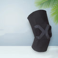 Men's silicone knee pads in black and blue, shown worn on the knee.
