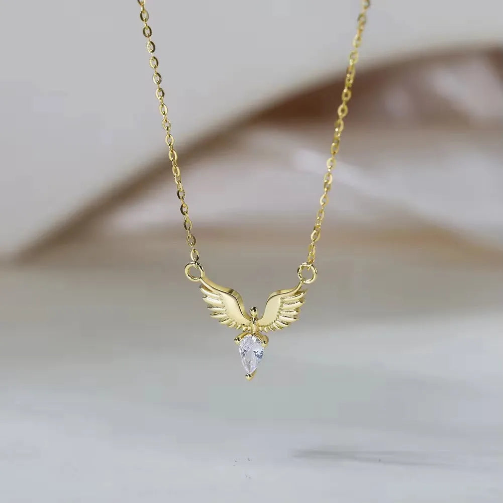 Sterling silver eagle pendant necklace on an O-ring chain, showing white gold and yellow gold colour options.