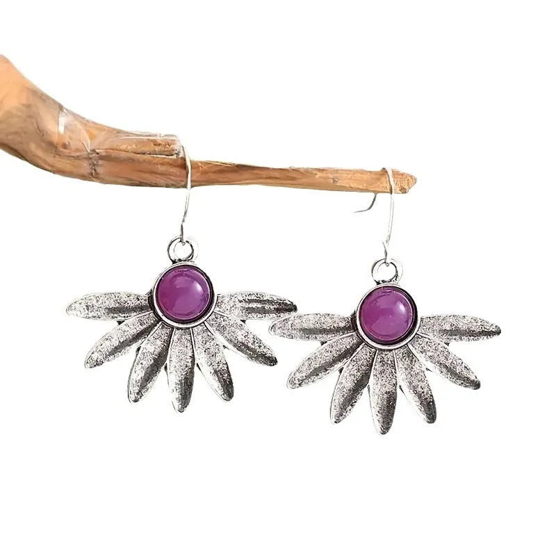 Purple Bohemian style earrings with animal zodiac design and floral elements