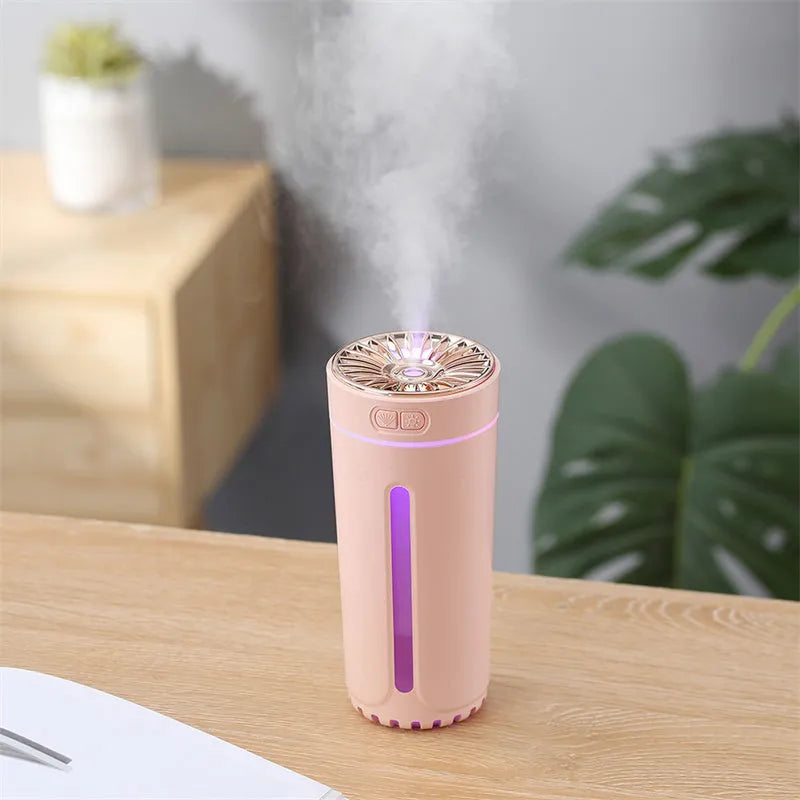 Black portable USB humidifier with colourful lights on car dashboard