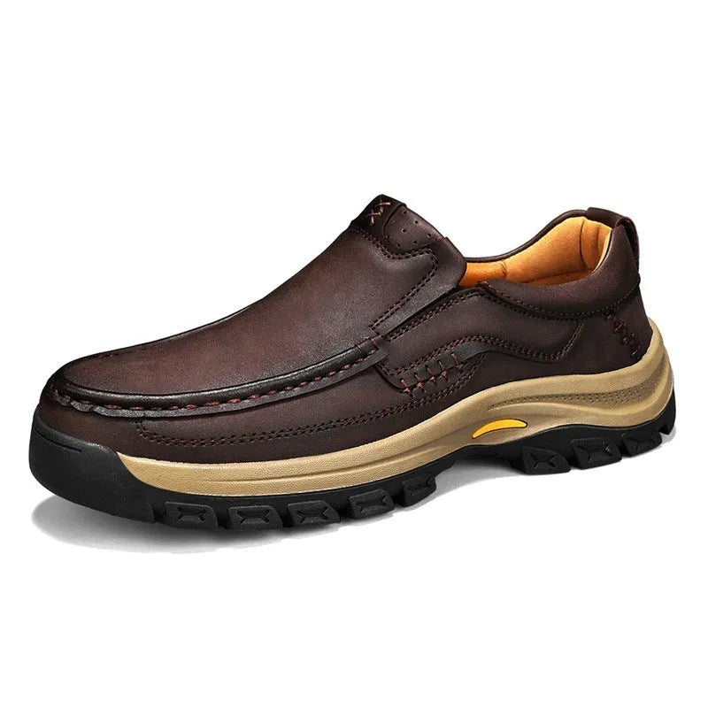 Men's black thick-soled outdoor mountaineering shoes with round toe and rubber sole.