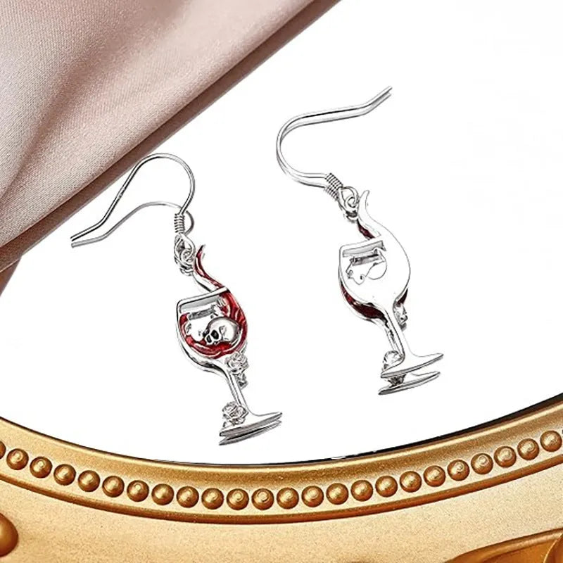 Geometric skull wine glass drop earrings in metallic finish