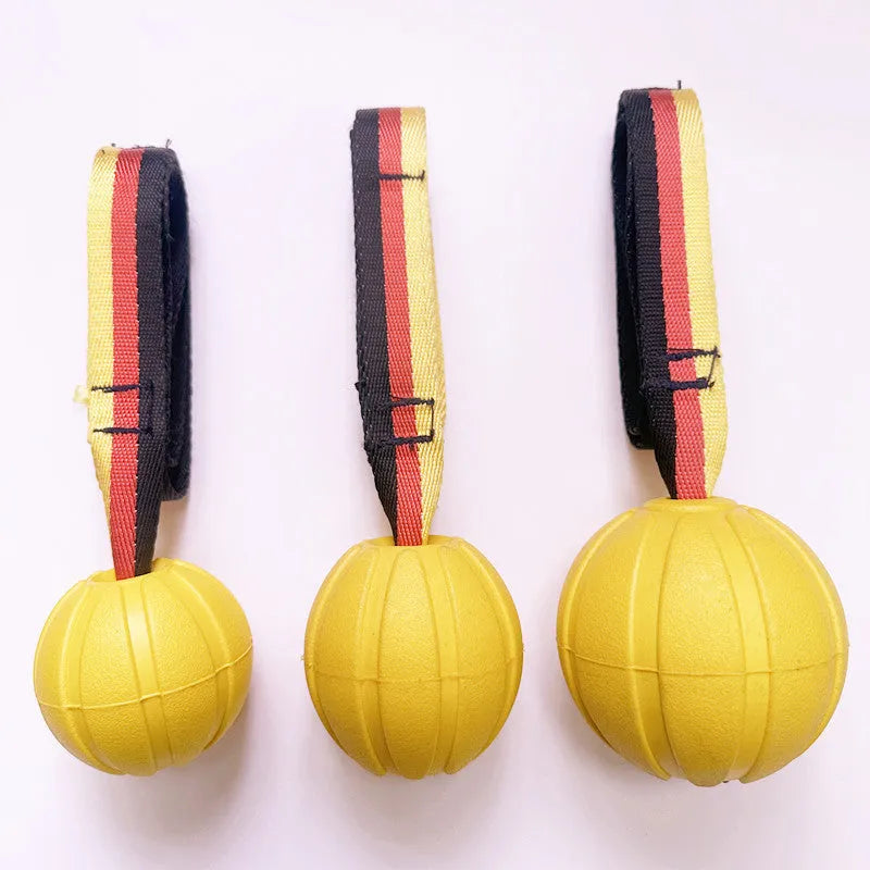 Floating EVA dog training ball with attached string in camouflage or yellow colour options