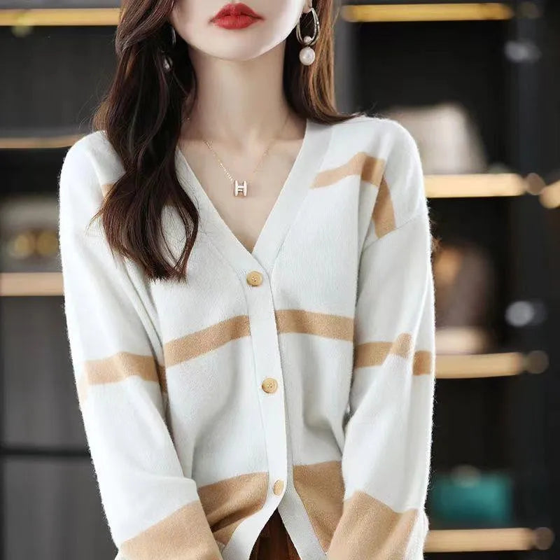 Women's black and white striped knitted cardigan with 3D pattern, V-neck, and button-up front.