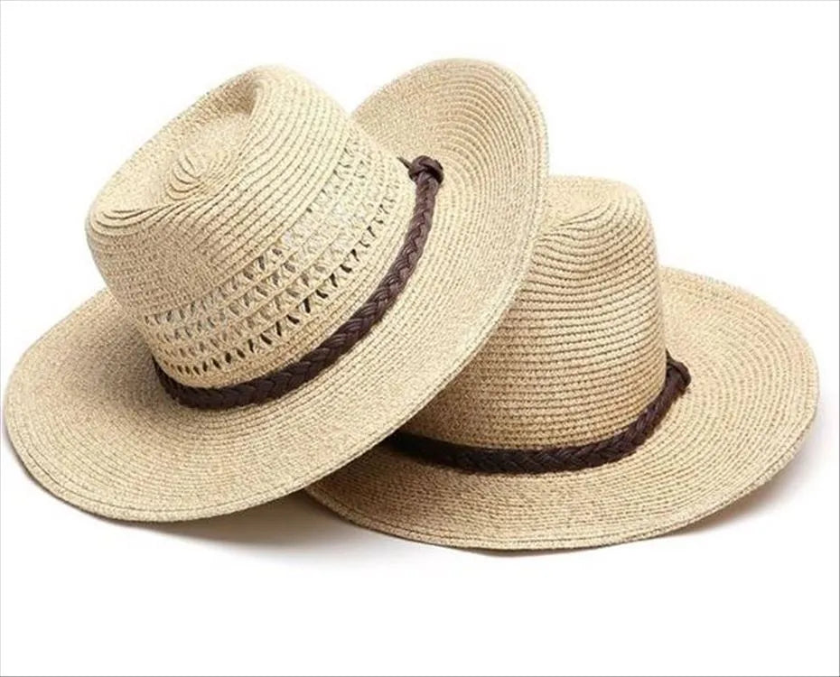 Men's foldable straw sun hat with large brim in beige colour on wooden surface