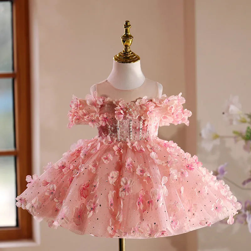 Girls pink polyester pettiskirt princess style dress on white background showing full skirt shape