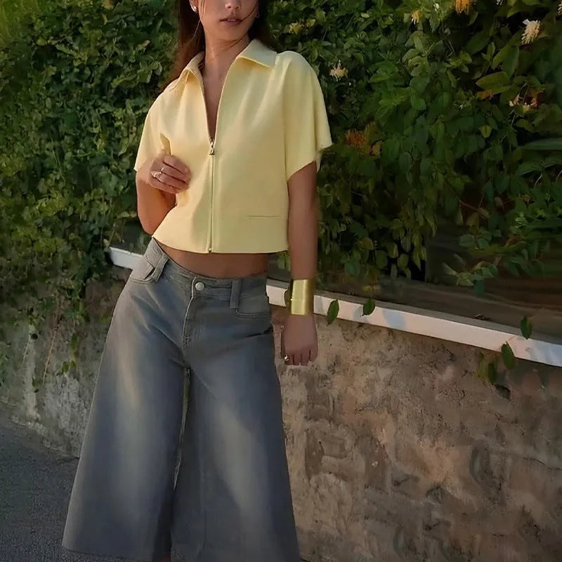 Loose-fit short-sleeve casual top in polyester, shown in white, black, and yellow colour options.