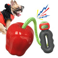 Green and red plastic apple-shaped dog toy with hollow centre for treat dispensing
