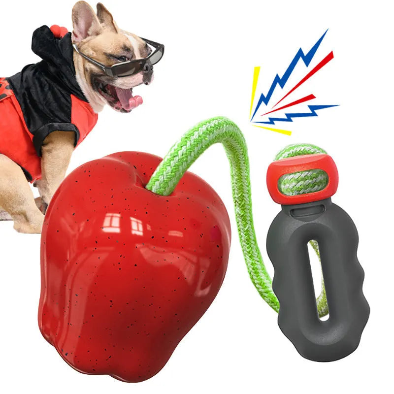 Green and red plastic apple-shaped squeaky dog toy for molar care and outdoor play