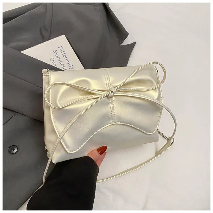 Women's black PU leather crossbody bag with square shape and sewing line detailing