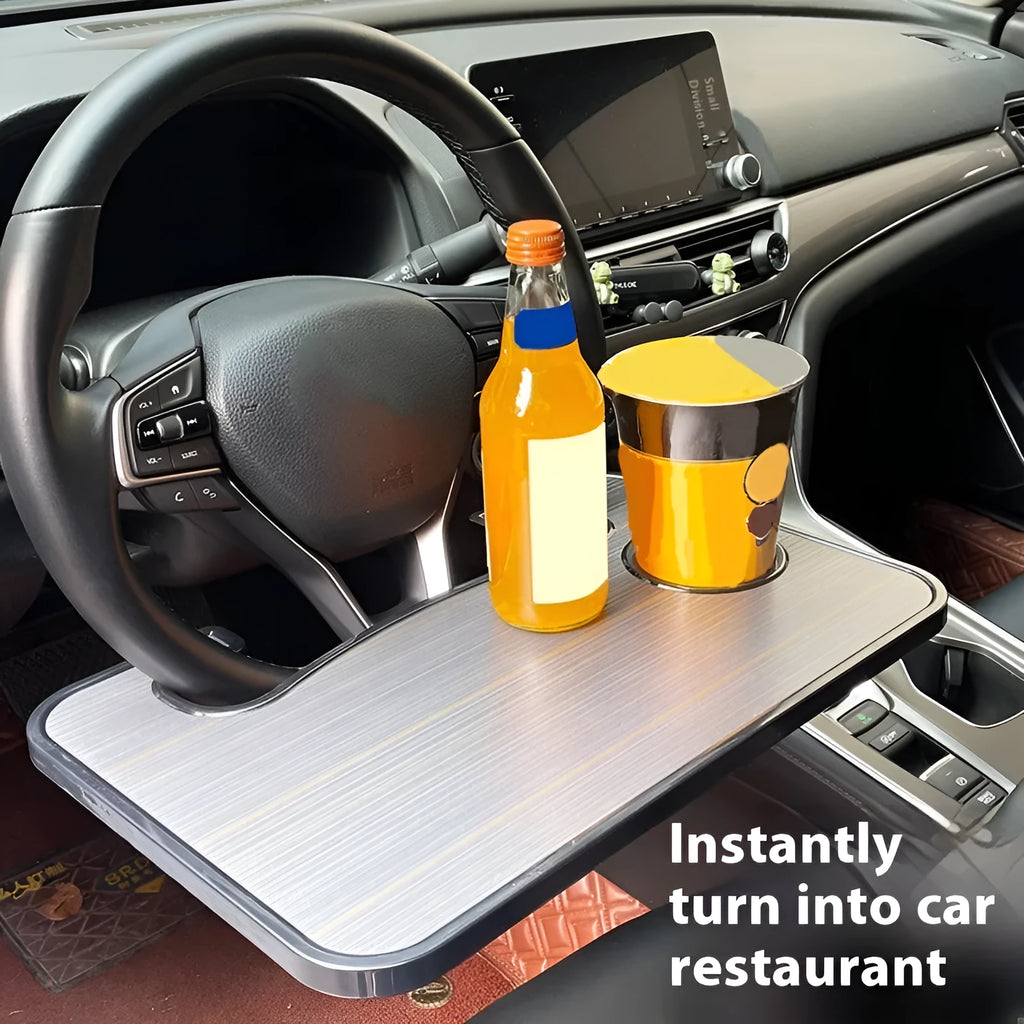 Large black car steering wheel laptop and dining tray table with foldable cup holder, shown on a steering wheel.