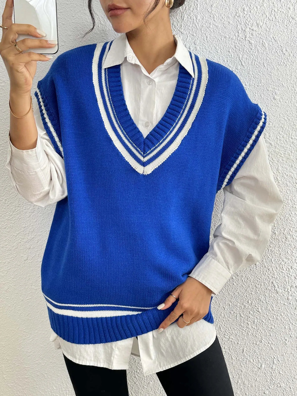 A loose-fit women's vest sweater in a college style, shown in a choice of colours.
