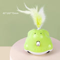 Green USB rechargeable electric cat teaser with rabbit design, infrared laser, and feather attachments on a floor