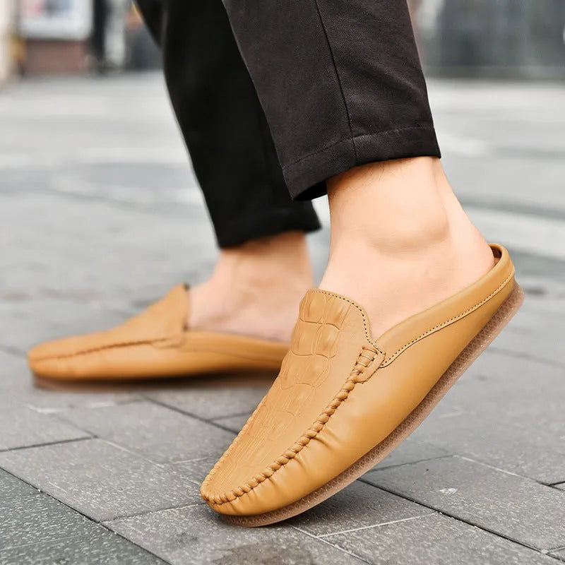 Men's black breathable Gommino semi-slippers with artificial PU upper and rubber sole on a white background