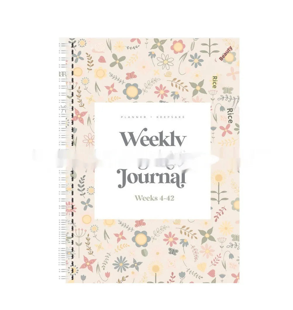 A5 weekly pregnancy diary notebook open to show weekly tracking pages
