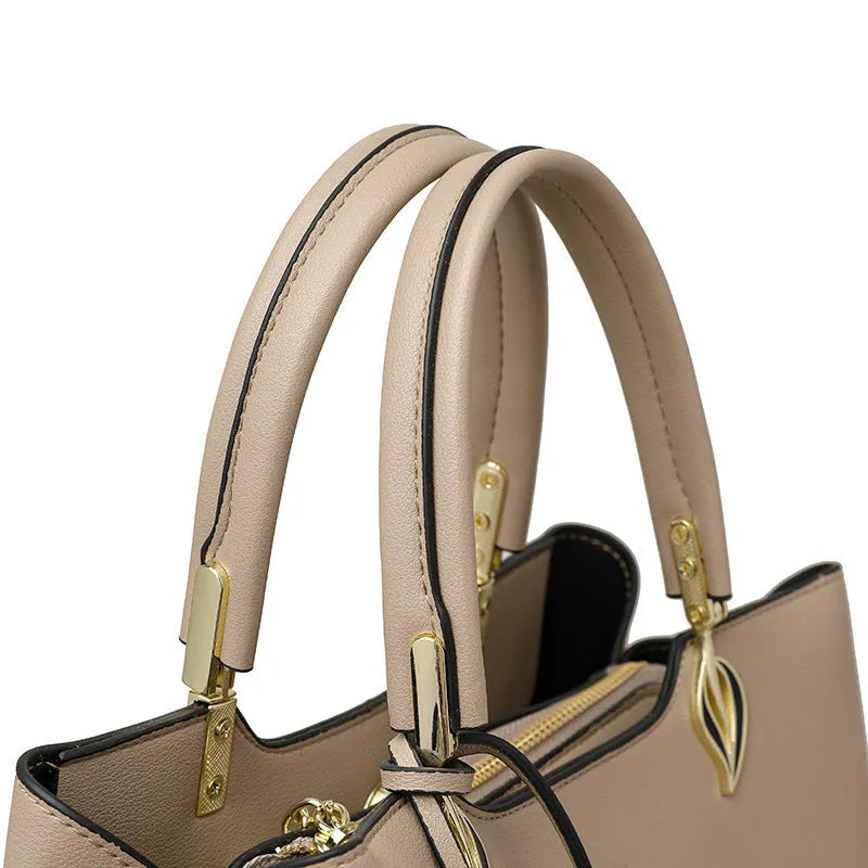 Women's black PU messenger bag with multi-layer shoulder strap and sewing thread detailing