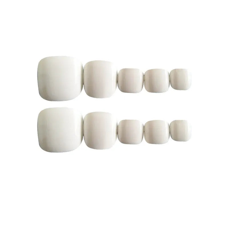 Set of white false nails with a starry sky pattern and pre-applied adhesive.