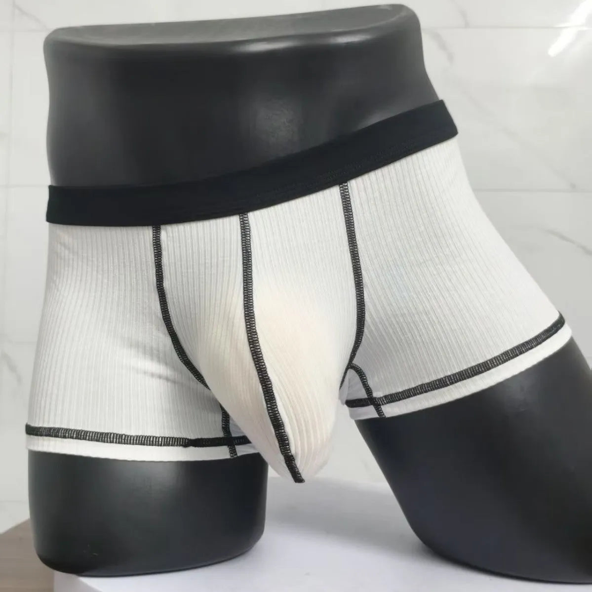 Men's solid colour breathable boxer shorts showing body shaping design in five colour options