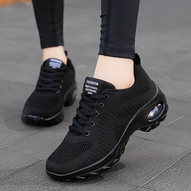 Red women's mesh lace-up low-top sneakers with a round toe and flat PU sole on a white background.