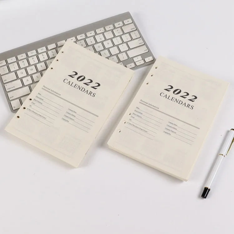 A5 white loose-leaf notebook inner pages with monthly plan layout on paper