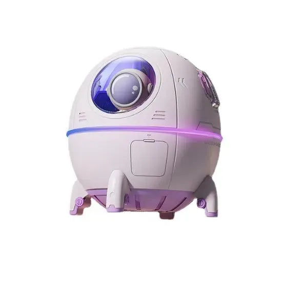 Astronaut-shaped portable USB humidifier with colourful LED light on a desk