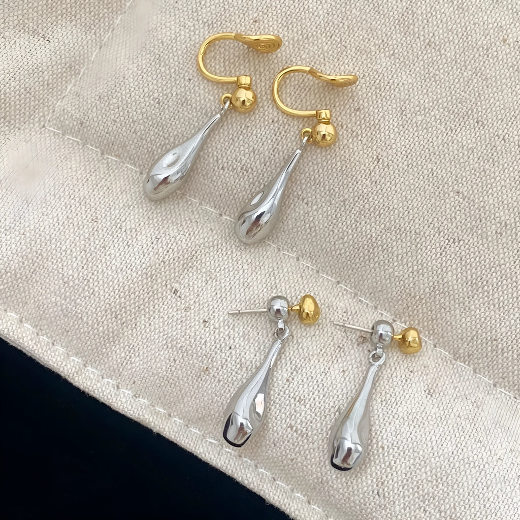 Water drop colour clash copper ear clips with teardrop and geometric shapes on women's ear
