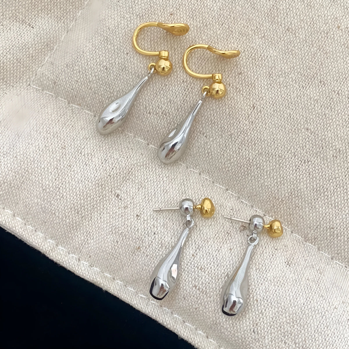 Water drop colour clash copper ear clips with teardrop and geometric shapes on women's ear