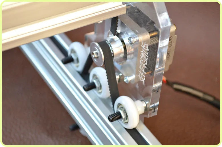 Miniature desktop laser engraving machine with 400mm by 300mm base plate for marking and lettering.