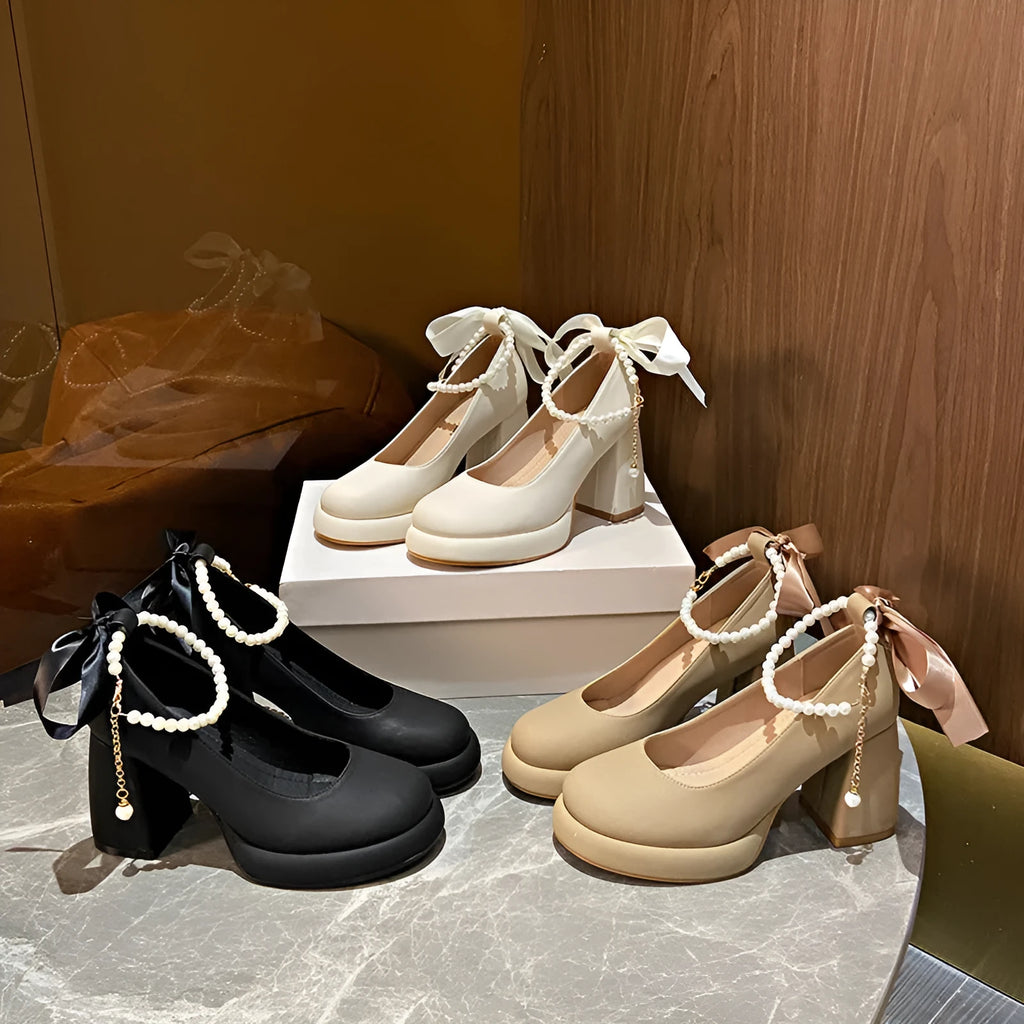Women's beige Mary Jane shoes with ankle strap buckle, chunky low heel, pearl detail and round toe.