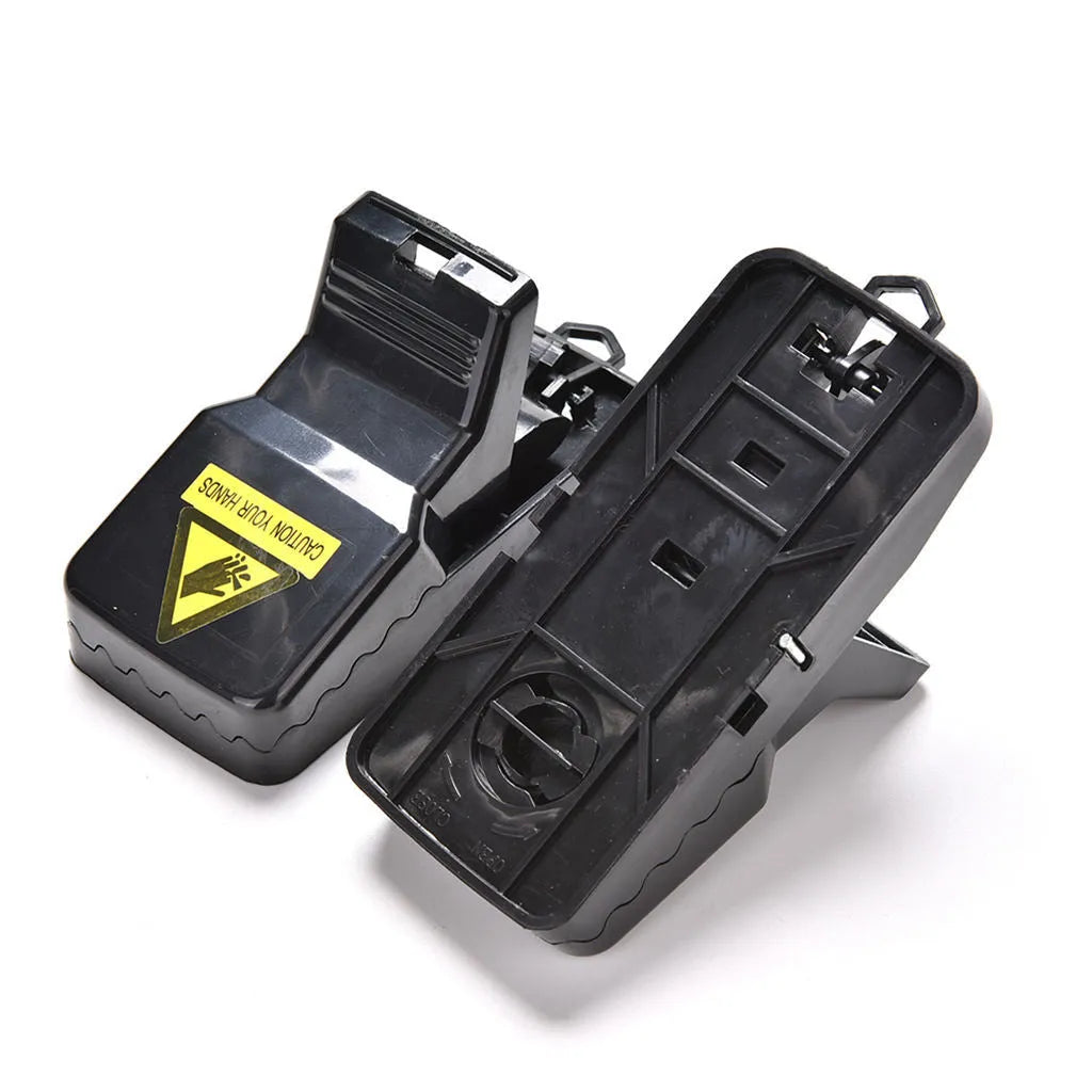 Six black snapping mousetraps with smooth plastic surface showing precise dimensions