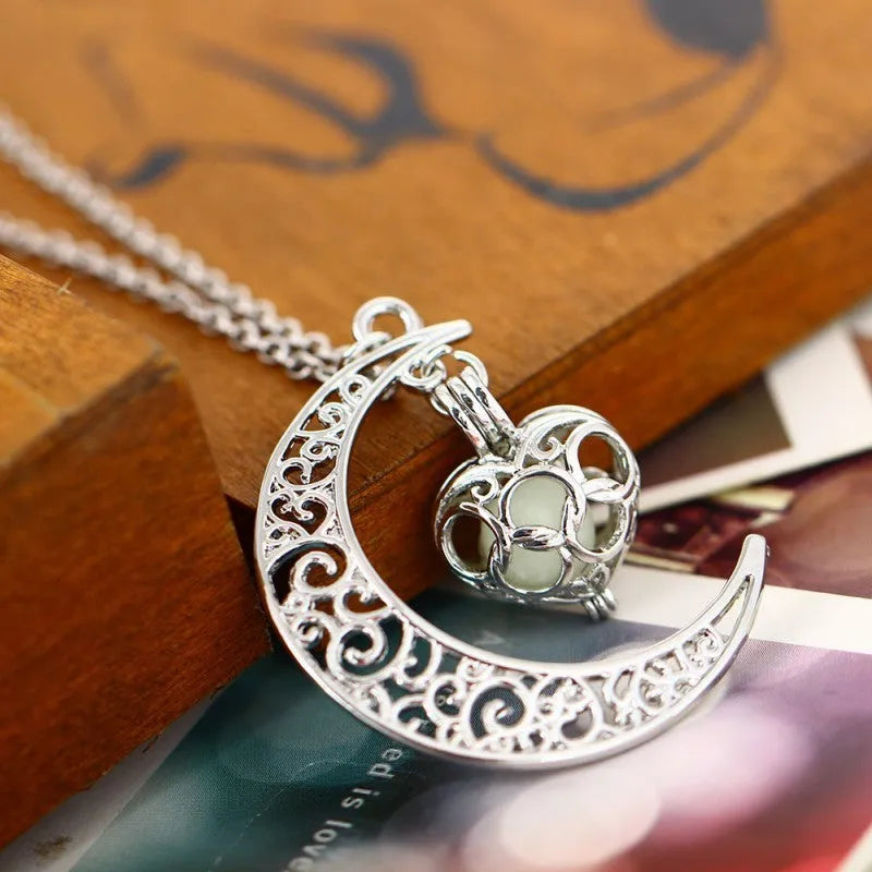 Glowing pendant necklace with silver plated chain and luminescent glow in dark, 3.6cm wide pendant