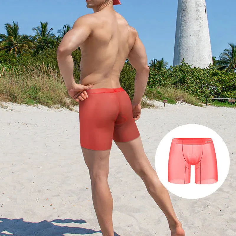 Men's solid colour ice silk boxer shorts in low-waist design shown in orange, pink, and red colours