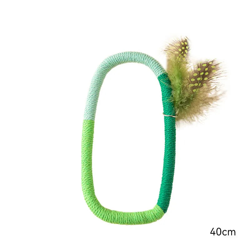 Green circular cotton rope cat toy with feathers attached, measuring 25cm diameter