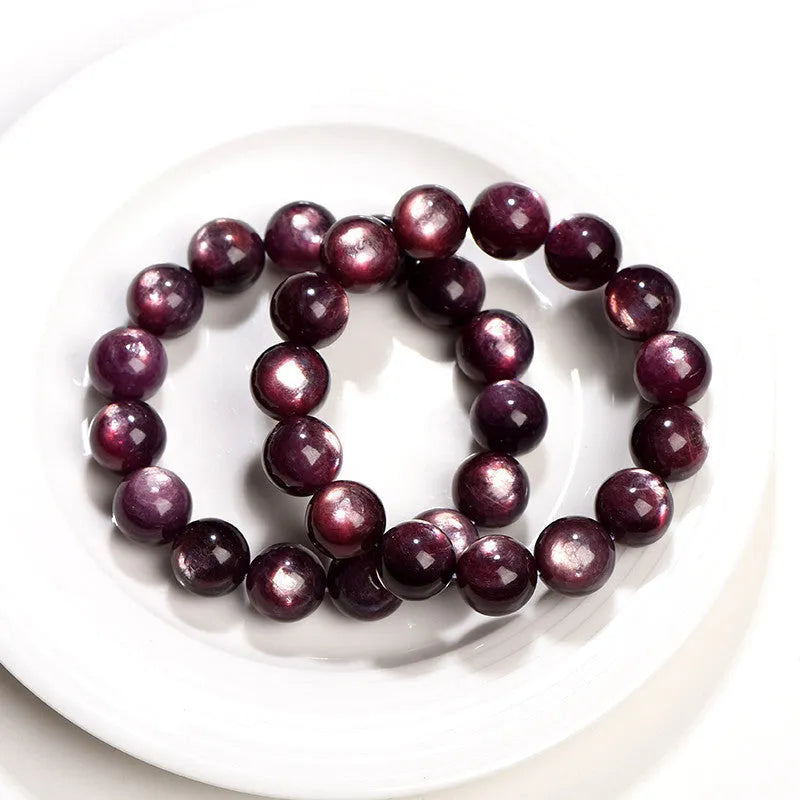 Natural purple lepidolite crystal round bead bracelet on a white background, showing available bead sizes.