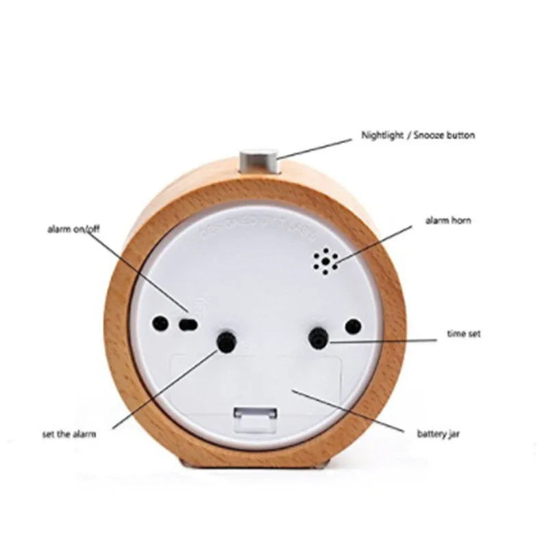 Solid beech wood silent snooze alarm clock with white dial and black numerals on a wooden surface.