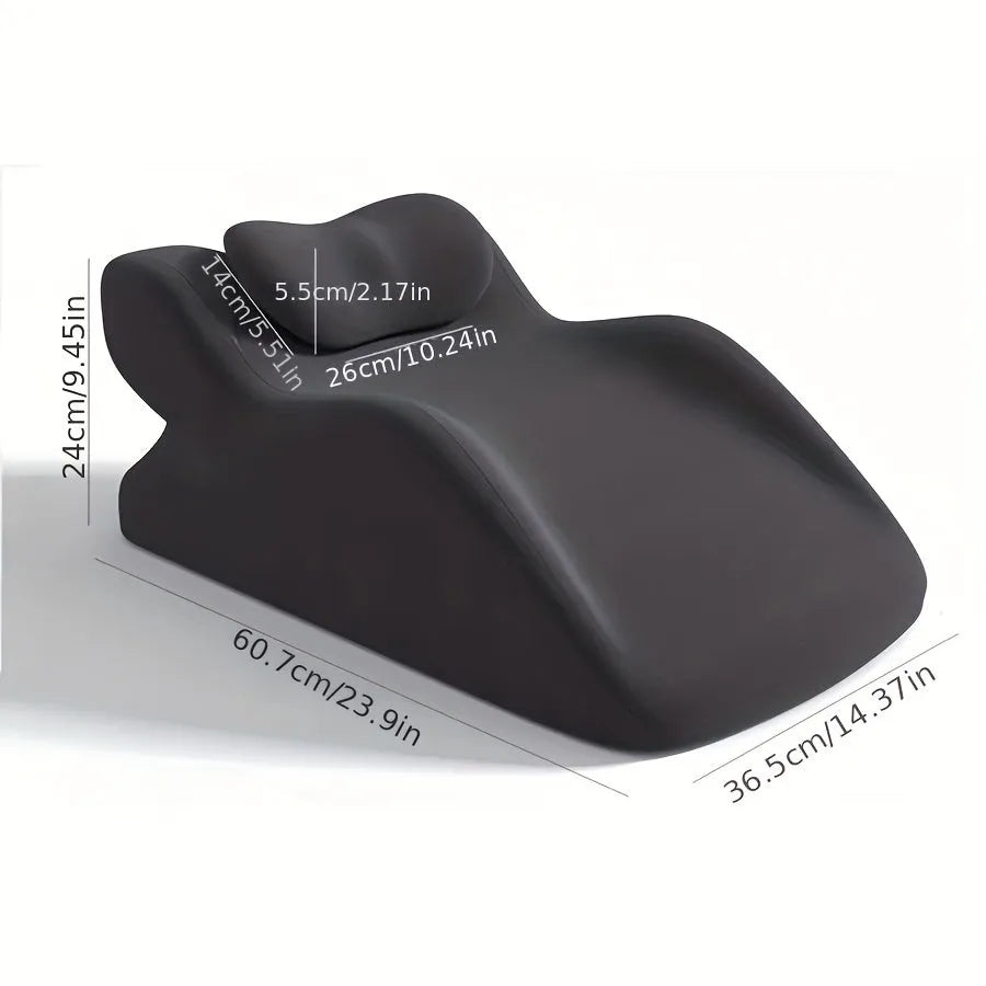 A blue stomach sleeper pillow on a bed, designed for lying face down.