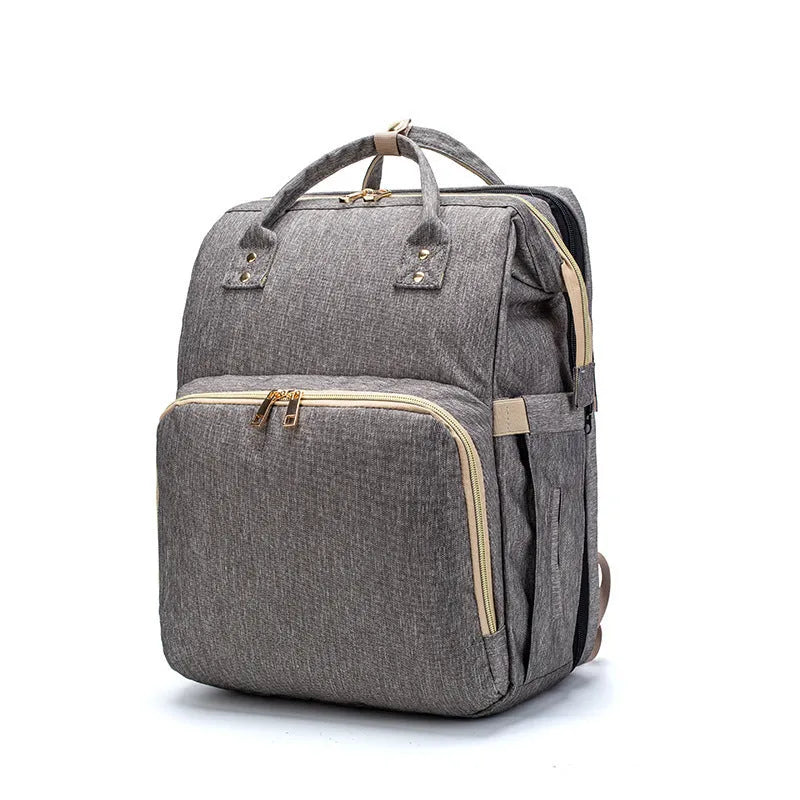 Folding baby bag bed backpack with portable mattress, USB charging option, front pocket, and multiple colour choices