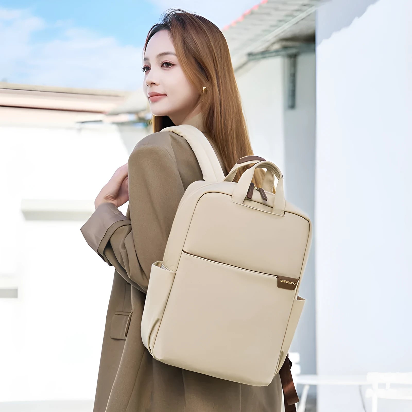 Simple canvas women's backpack in apricot colour showing internal organiser compartments and external pocket.