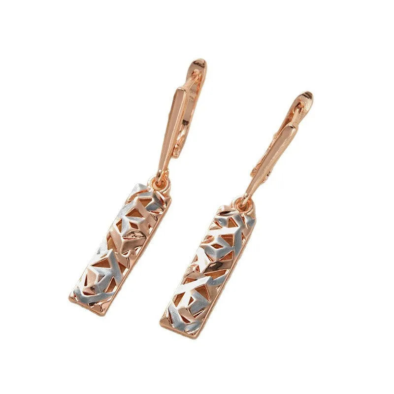 A pair of rectangular two-tone hollow stud earrings with a geometric shape and electroplated finish.