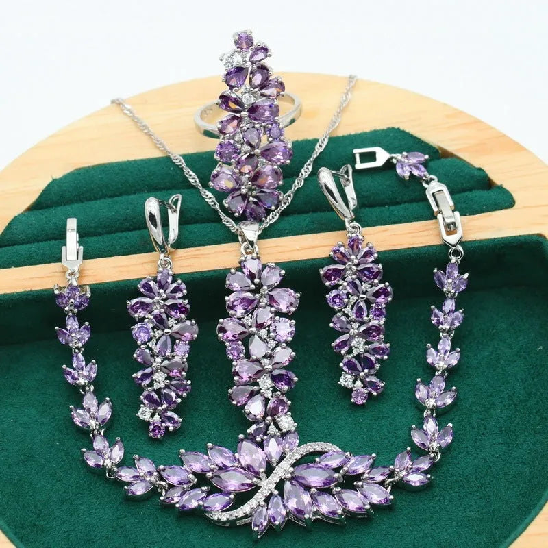Retro floral pattern jewellery set with copper, zircon, and alloy pendant, showing necklace, bracelet, earrings, and ring in olive and purple colours.