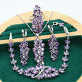 Retro floral pattern jewellery set with copper, zircon, and alloy pendant, showing necklace, bracelet, earrings, and ring in olive and purple colours.
