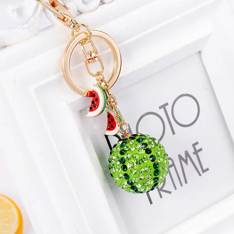 Green watermelon-shaped zinc alloy keychain measuring 12cm long
