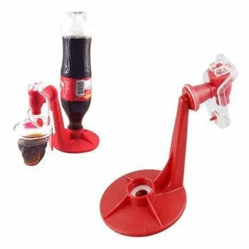 Red plastic Magic Tap soda drink dispenser for 2-litre bottles on a kitchen counter.