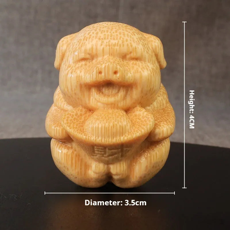 Solid bamboo Fulu pig carving ornament measuring 4cm tall with 3.5cm diameter in cute style