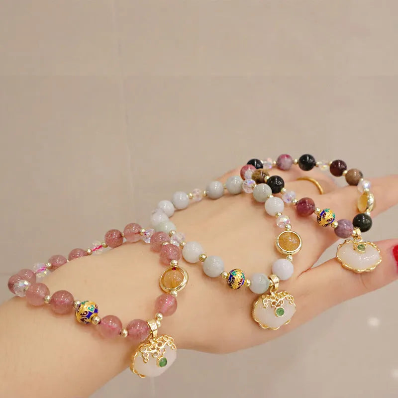Geometric women's bracelet with ethnic metal decoration, available in Gray Jade or Strawberry Quartz.
