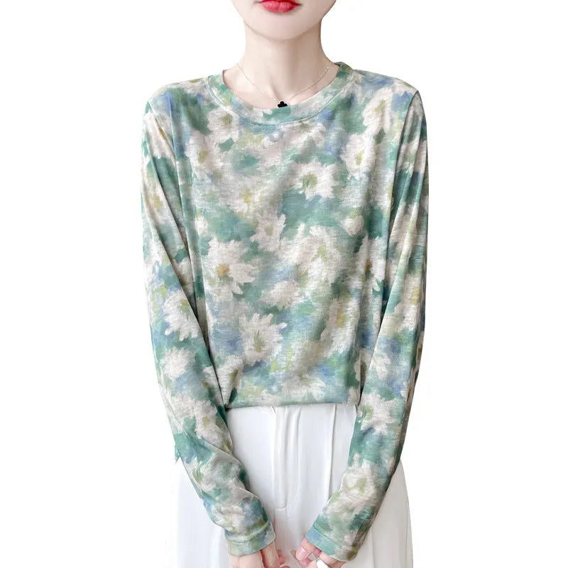Women's round neck knit pullover shirt with artistic floral print in Tencel cotton fabric.